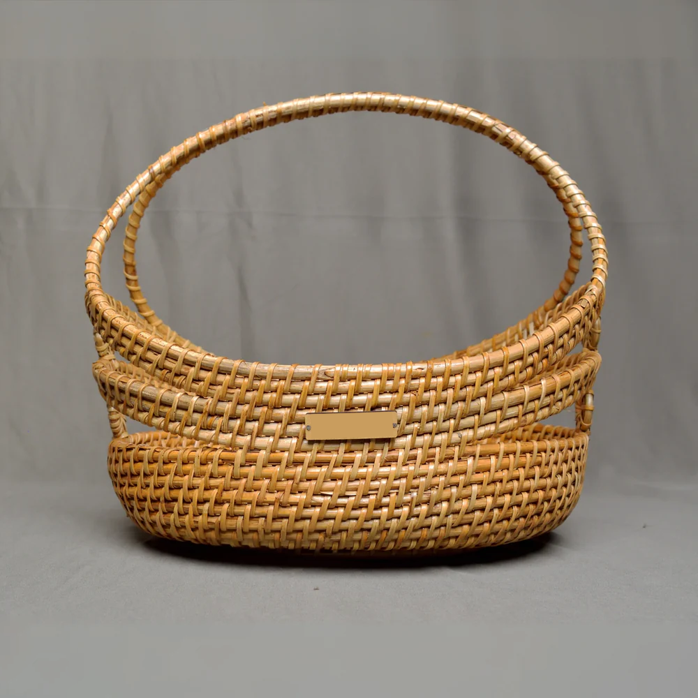 Stock Keeper - Sculptural Oval Rattan Basket with Arch Handle
